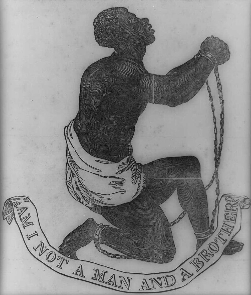 Woodcut image of male enslaved in chains